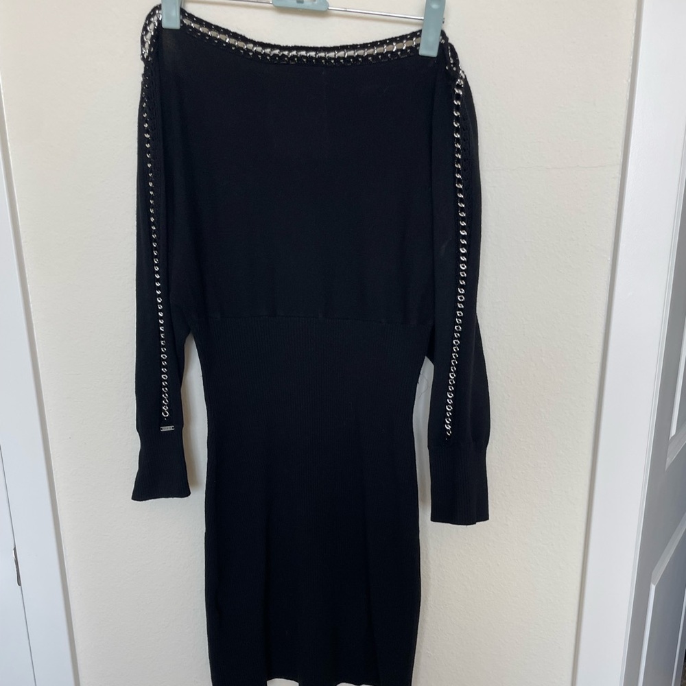 Black long sleeved sweater dress by Guess with inlaid silver chain